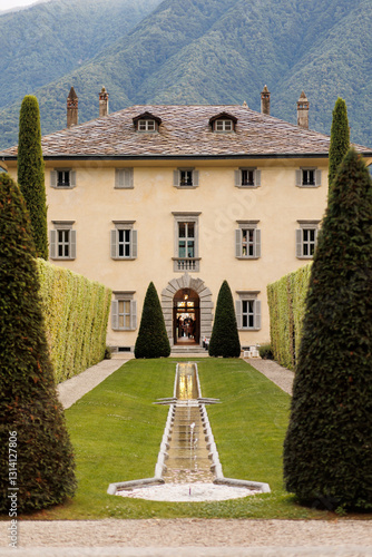 Canvas Print Italian famous historical antique villa Balbiano surrounded with pine trees at C