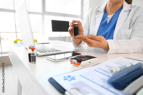 Female doctor with ampule a...