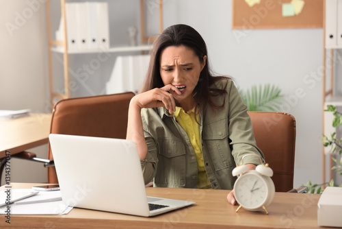 Stressed young businesswoma...