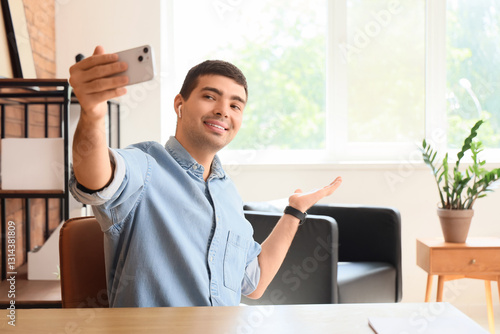 Young man with mobile phone...