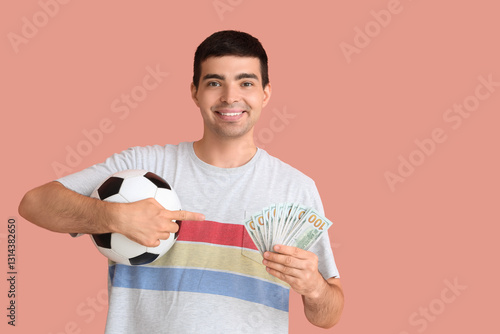 Happy young man with soccer...