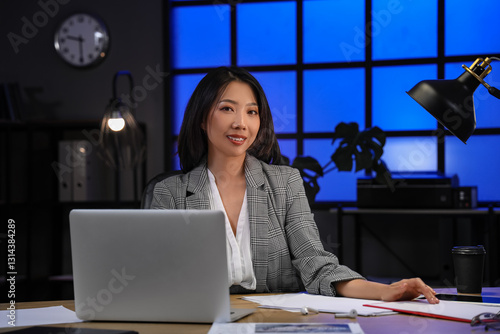 Happy Asian businesswoman s...