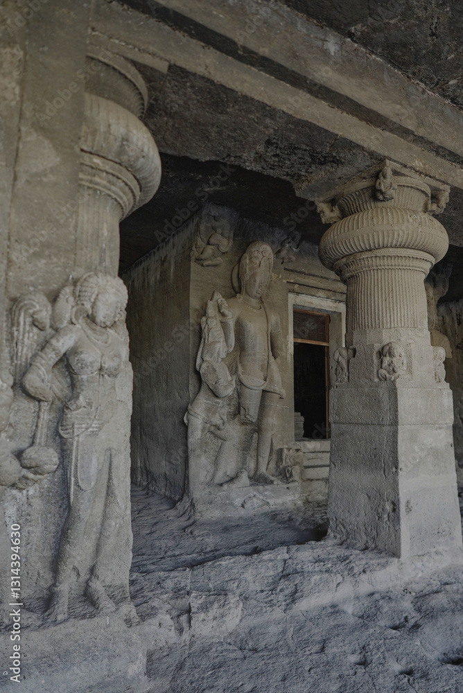 Fototapeta premium Ellora Caves in Maharashtra India, which is a UNESCO World Heritage Site, are the world's largest monolithic excavation of 34 Hindu, Buddhist and Jain temples carved into a basalt cliff. 