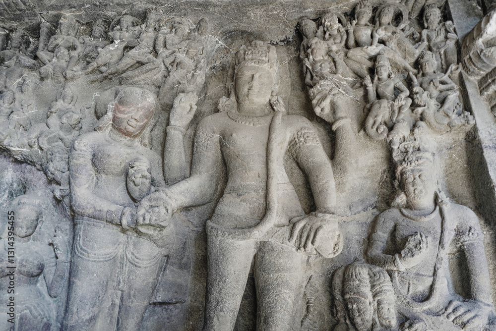 Obraz premium Ellora Caves in Maharashtra India, which is a UNESCO World Heritage Site, are the world's largest monolithic excavation of 34 Hindu, Buddhist and Jain temples carved into a basalt cliff. 