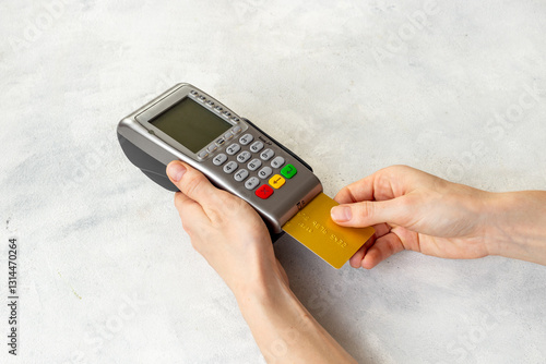 Wallpaper Mural Female holding in hands bank terminal for contactless payment by credit cards. Banking and shopping concept Torontodigital.ca
