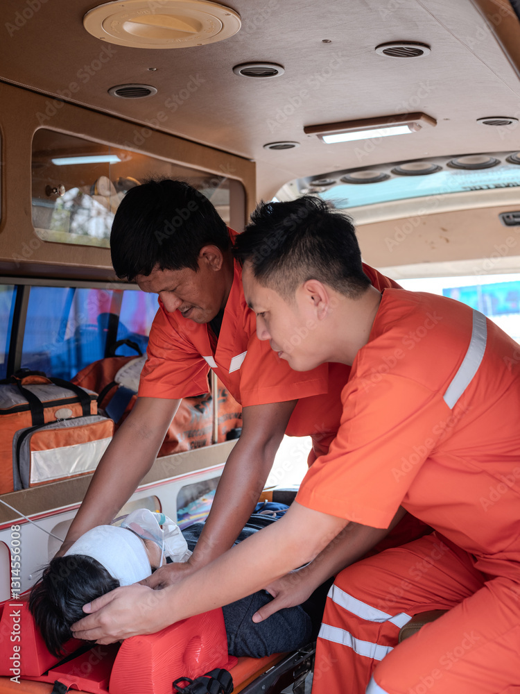 The paramedics used first aid and put on a breathing mask for a patient lying on a stretcher in the ambulance.