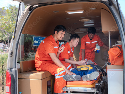 Obraz na płótnie Team of Paramedics Rushing to Provide Urgent Medical Care and Emergency Response in the Back of an Ambulance Van. Concept of Life-Saving First Aid, Rapid Crisis Intervention, w salonie
