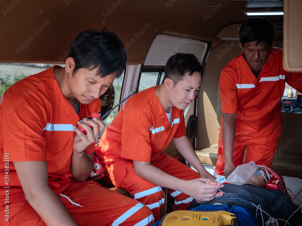 Emergency medical team working together to provide urgent care and transport a patient in the back of an ambulance, delivering lifesaving medical treatment and assistance during a critical situation.