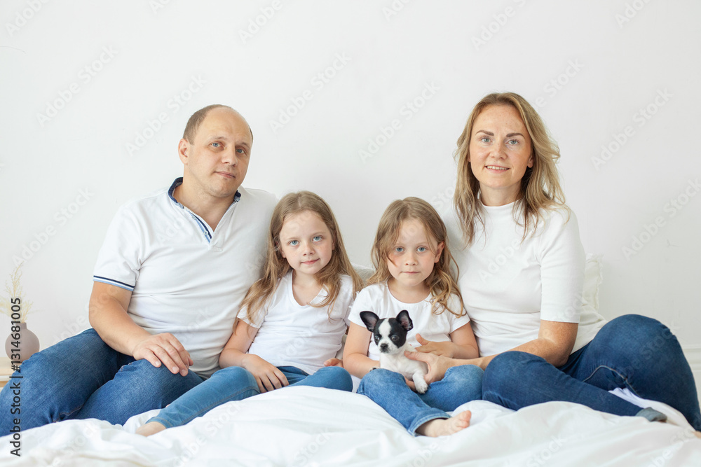 Mother, father and girls at home. Happy family Mother, father and girls at home. Happy family