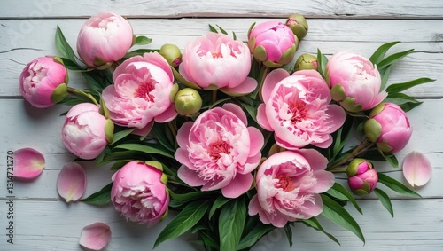 Fototapeta Naklejka Na Ścianę i Meble -  Lovely pink peonies arranged on a rustic white wooden background, with space for text. Floral greeting card, flat lay display. Beautiful peony flowers, delicate image.