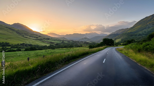 Winding Country Road through Lush Valley at Sunset