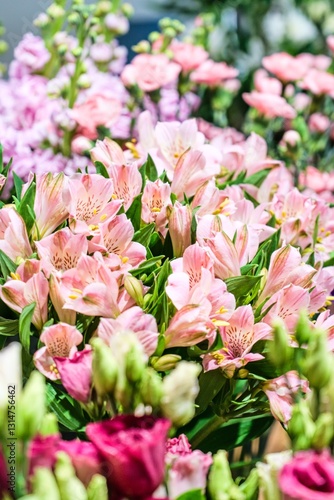 Soft Pink Alstroemeria Bouquet with Colorful Floral Bokeh Background