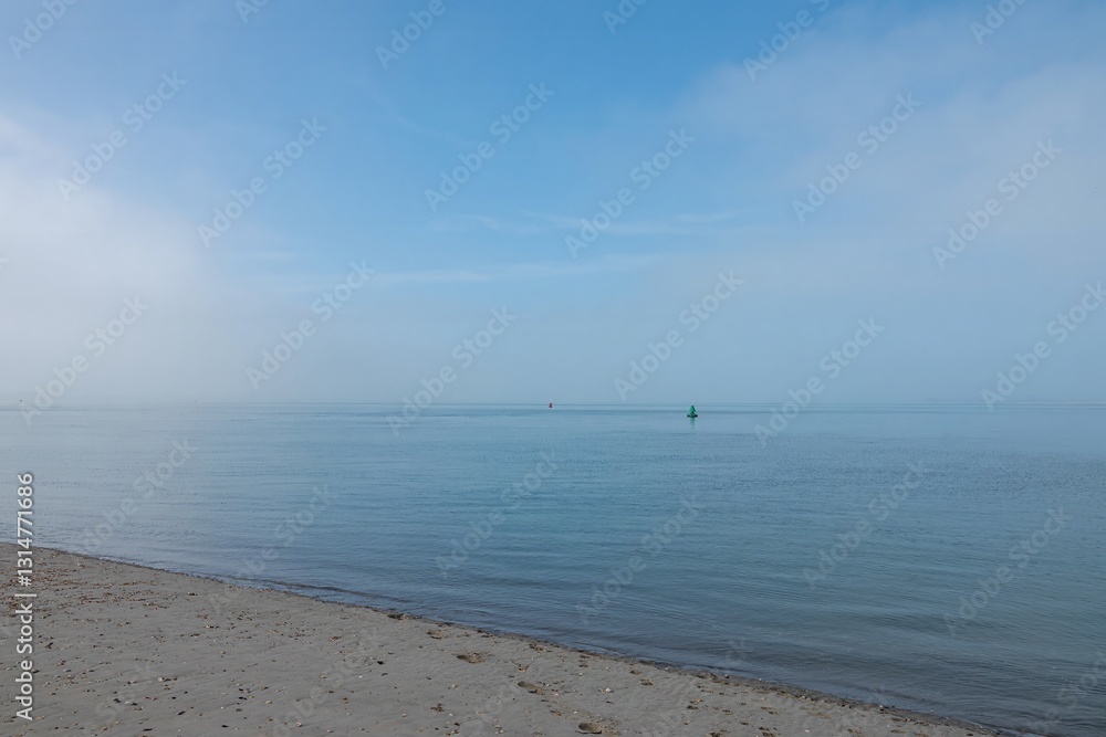 beautiful deserted beach at The Witterings West Sussex on a misty spring day beautiful deserted beach at The Witterings West Sussex on a misty spring day