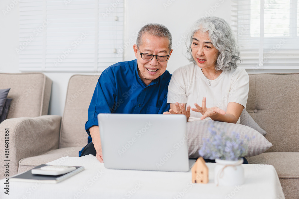 Senior Couple Sitting on Sofa, Using Laptop Together in Bright Living Room, Expressing Happiness and Engagement. Senior Couple Sitting on Sofa, Using Laptop Together in Bright Living Room, Expressing Happiness and Engagement.