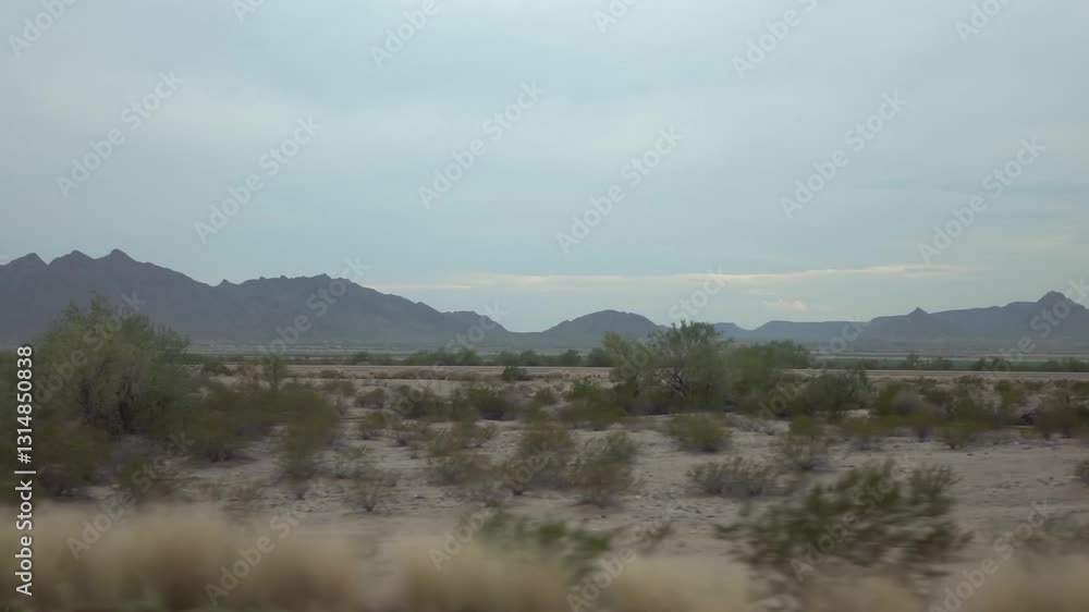 Desert highway with mountain backdrop in Arizona in slow motion 120fps Desert highway with mountain backdrop in Arizona in slow motion 120fps