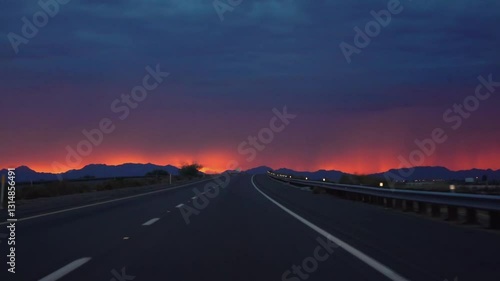 Driving on a road to Yuma, Arizona with a vibrant sunset in slow motion 120fps