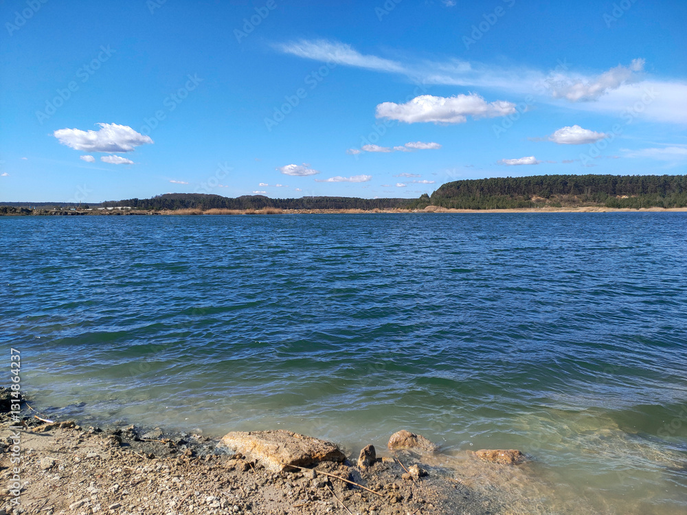Scenic landscape with a lake, forest, and sky Scenic landscape with a lake, forest, and sky