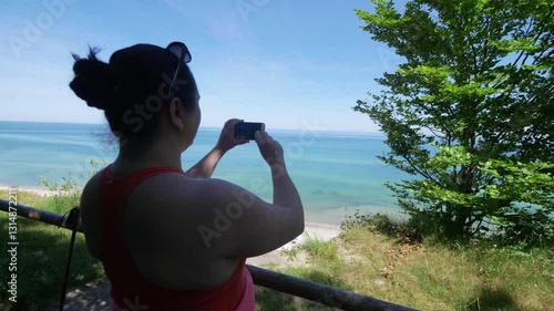 Wallpaper Mural Woman Capturing Pictures of the Beautiful Baltic Sea Beach in Poland in 4k slow motion 60fps Torontodigital.ca