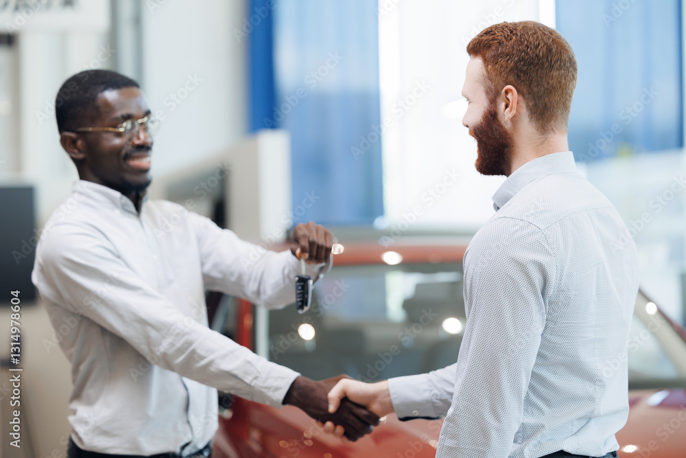 Obraz premium Car dealers shake hands and over keys with new owner customers after signing contracts in showroom