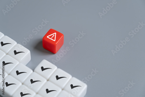 close up at the red cube to identify red danger risk cube among other normal incident. Risk management concept for business and personal planning for risk mitigation.