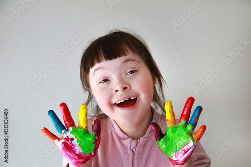 Cute little girl with painted hands