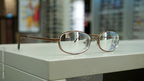 Fotografie Purchasing corrective short-sighted glasses in an optic shop