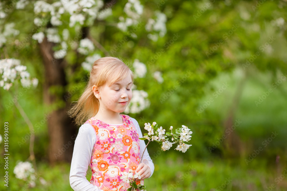 Little blonde girl admiring a blooming apple tree branch in a spring garden Little blonde girl admiring a blooming apple tree branch in a spring garden