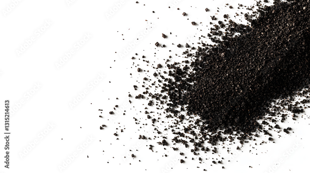 Ground black pepper scattered on a smooth white background, with emphasis on its fine, dark granules and powdery texture. Ground black pepper scattered on a smooth white background, with emphasis on its fine, dark granules and powdery texture.