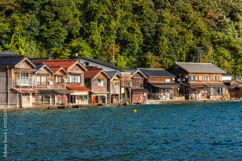 Fototapeta premium Beautiful later afternoon sight in Ine Bay, with the typical Funaya boat houses. Kyoto, Japan.