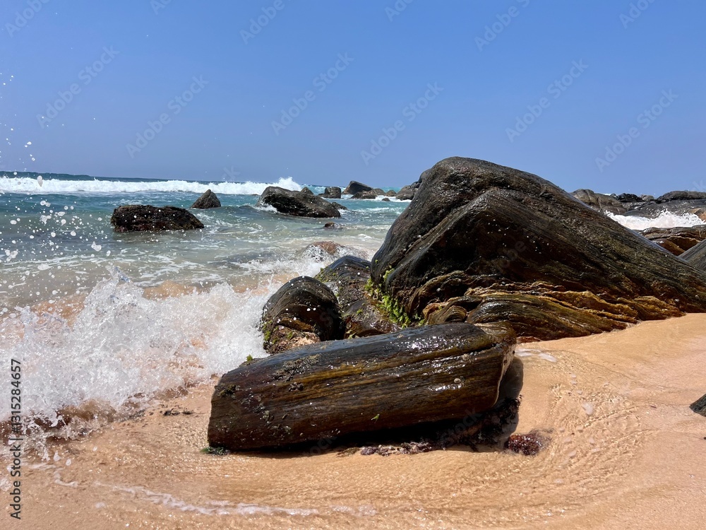 ocean waves crashing on the shore against rocky cliffs on the beach natural view calm atmosphere of a summer beach holiday