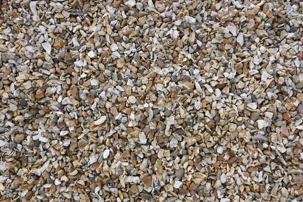 A pile of gravel with a lot of white and brown rocks A pile of gravel with a lot of white and brown rocks