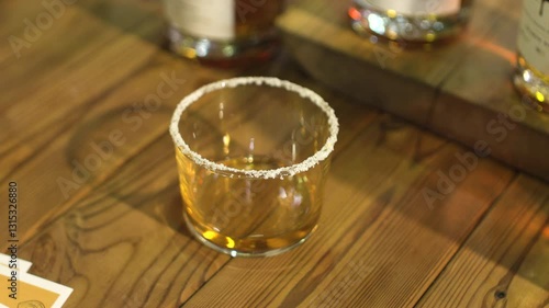 Close-up of sparkling premium alcohol pouring into a crystal glass. Ideal for luxury ads, cocktail promos, festive campaigns. 4K detail captures dynamic flow and radiant reflections