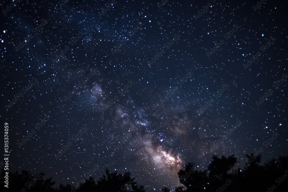 Starlit sky over a quiet landscape reveals the beauty of the Milky Way galaxy Starlit sky over a quiet landscape reveals the beauty of the Milky Way galaxy