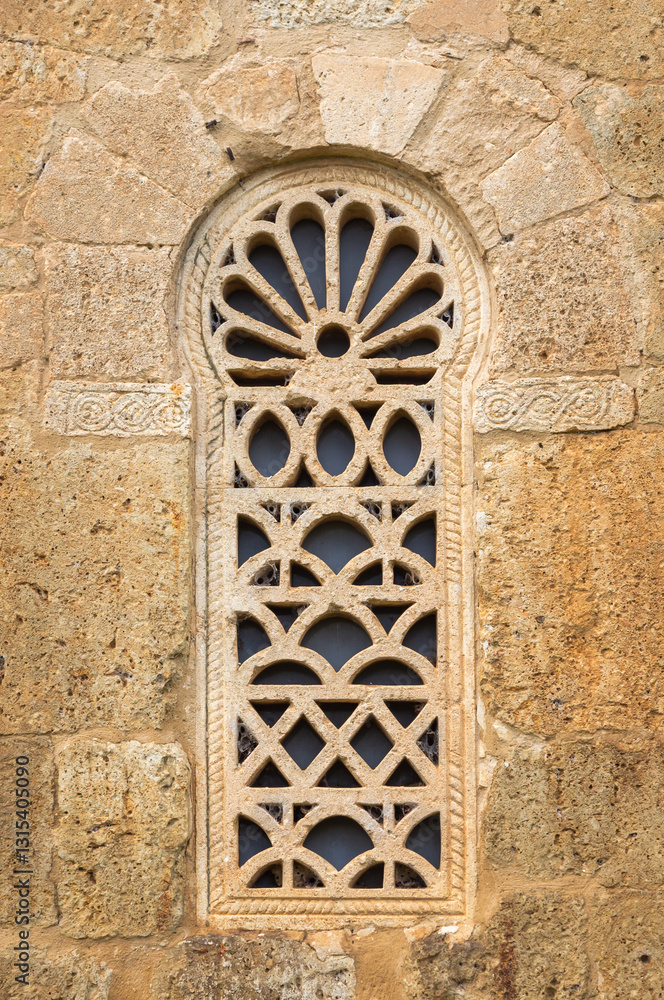 Fototapeta premium Visigothic Window: Lattice and Horseshoe Arch at San Juan de Baños.