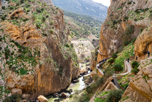 Hikers on El Caminito del Rey enjoy the stunning scenery of this impressive walkway pinned on steep gorge walls.