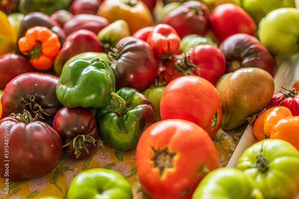 Colourful assortment of tomatoes and peppers on a table. Colourful assortment of tomatoes and peppers on a table.