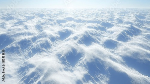 Aerial View of a Vast, Undulating Snowscape Under a Bright Sky