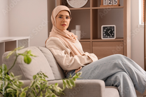 Young Muslim woman sitting ...