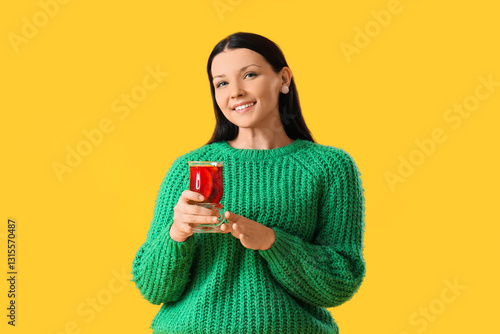 Young woman with glass of m...