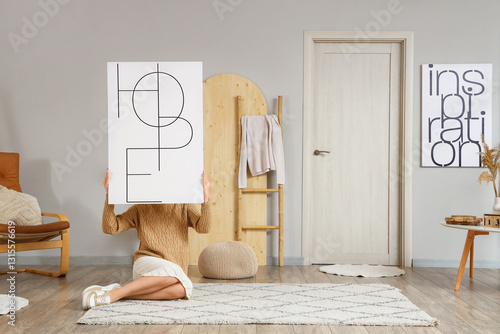 Woman with poster sitting o...