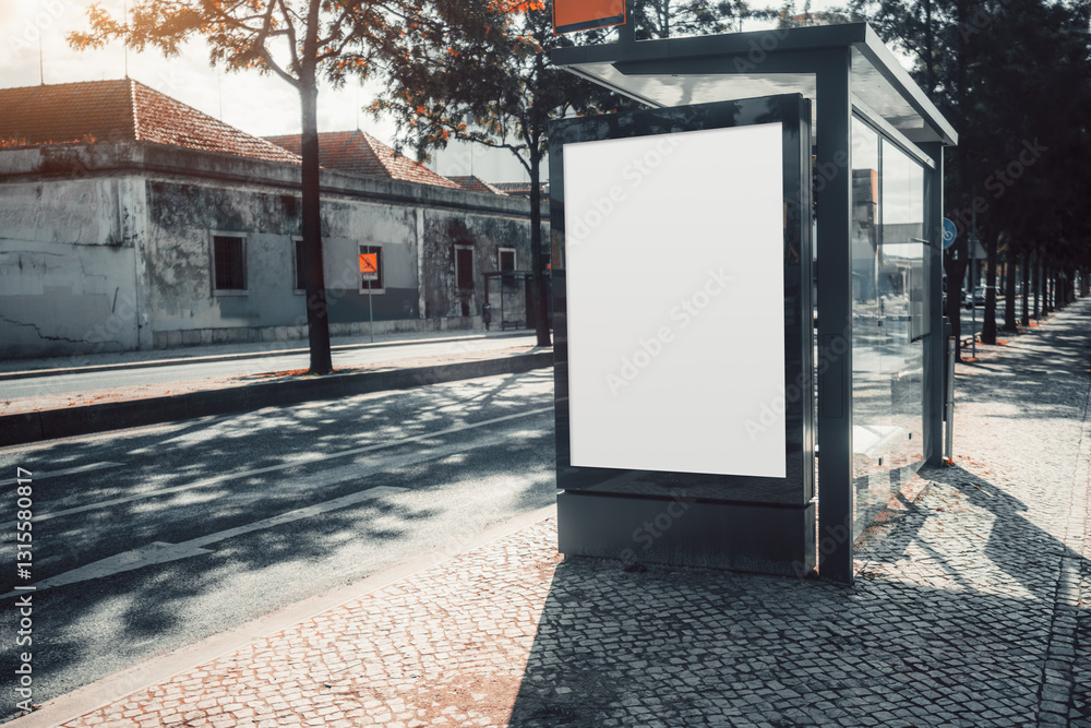 Bus stop advertising mockup with a blank white billboard in an urban street. Modern glass shelter with reflections, old building, tree shadows, and cobblestone sidewalk with a copy space area Bus stop advertising mockup with a blank white billboard in an urban street. Modern glass shelter with reflections, old building, tree shadows, and cobblestone sidewalk with a copy space area
