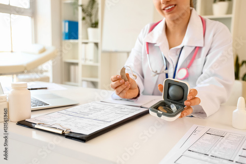 Female doctor with hearing ...