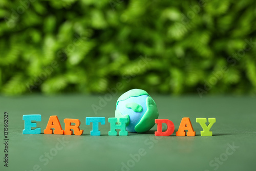 Text EARTH DAY with planet ...