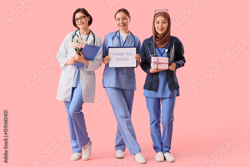 Female doctors holding clip...