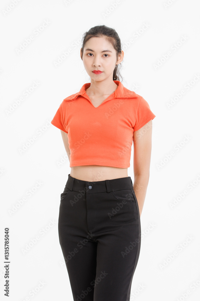 Fototapeta premium Portrait asian beautiful woman with curly ponytail hair, wearing orange shirt black long pants, model girl attractive confident charming standing pose looking at camera on white background in studio.