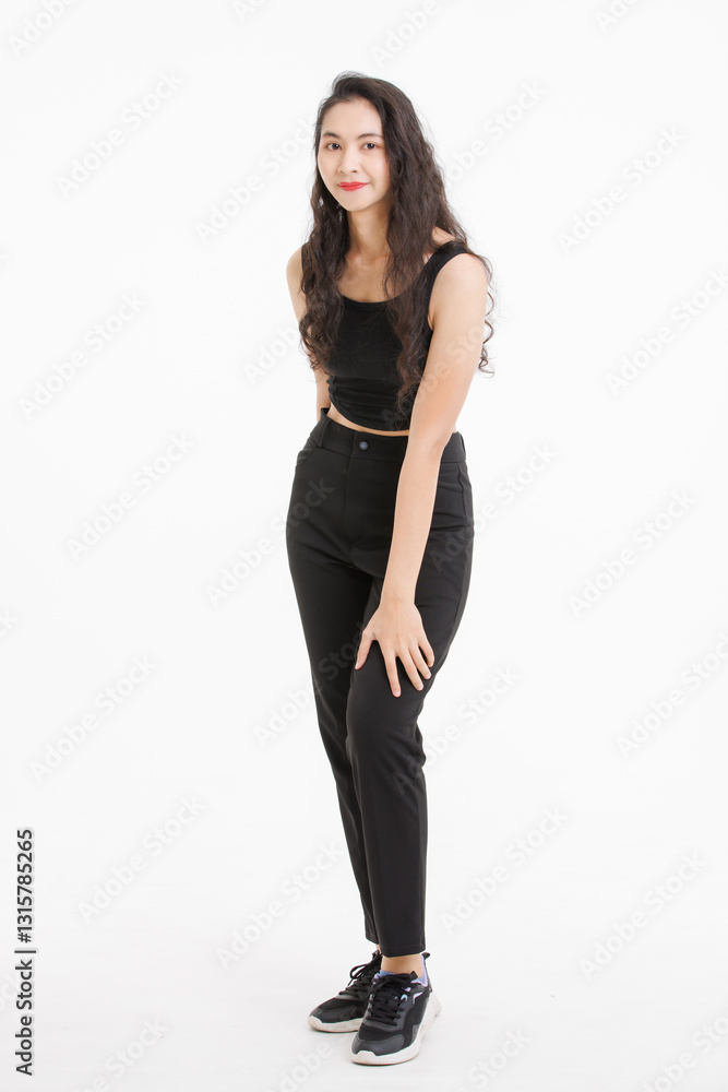 Fototapeta premium Portrait of full body asian beautiful woman with curly hair, wearing black tank top black long pants, model girl attractive confident standing smiling pose look at camera on white background in studio