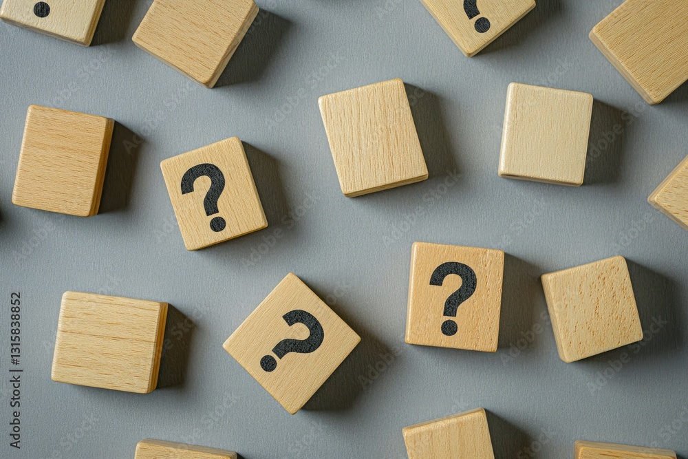 Wooden blocks with question marks on gray background (1) Wooden blocks with question marks on gray background (1)