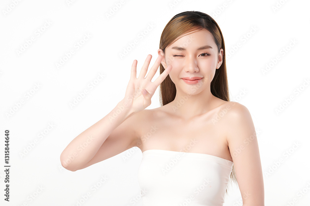 A beautiful young Asian woman with clear, radiant skin is holding up four fingers against a white background. Skincare, beauty, and spa. A beautiful young Asian woman with clear, radiant skin is holding up four fingers against a white background. Skincare, beauty, and spa.
