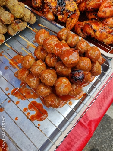 Vendor selling cuisine at street bazaar in Malaysia catered for iftar during Muslim fasting month of Ramadan