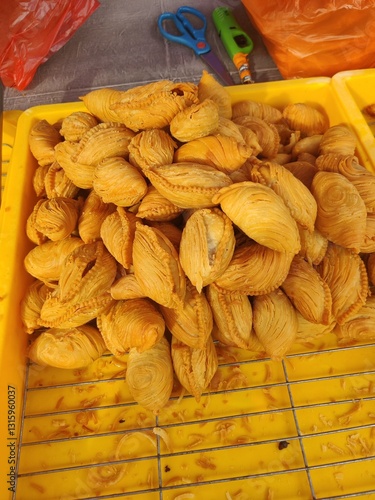 Vendor selling cuisine at street bazaar in Malaysia catered for iftar during Muslim fasting month of Ramadan